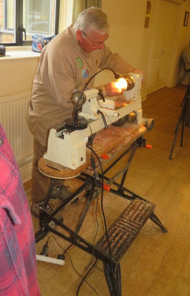 Keith working on a drop spindle